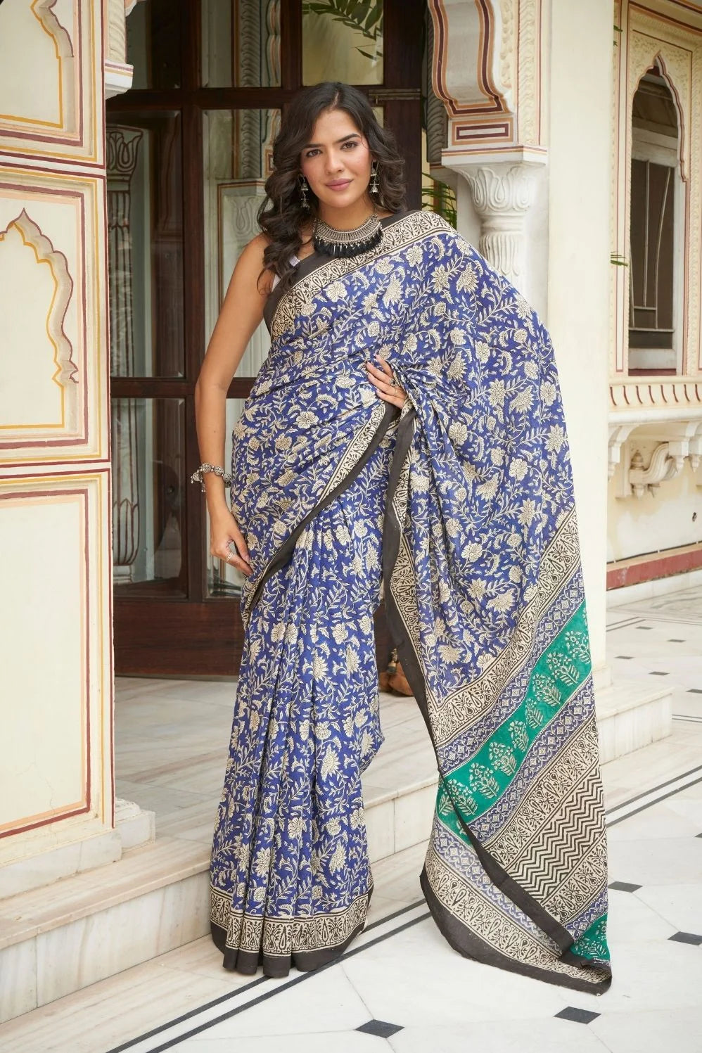 Blue and green mulmul cotton saree with detailed hand block print.