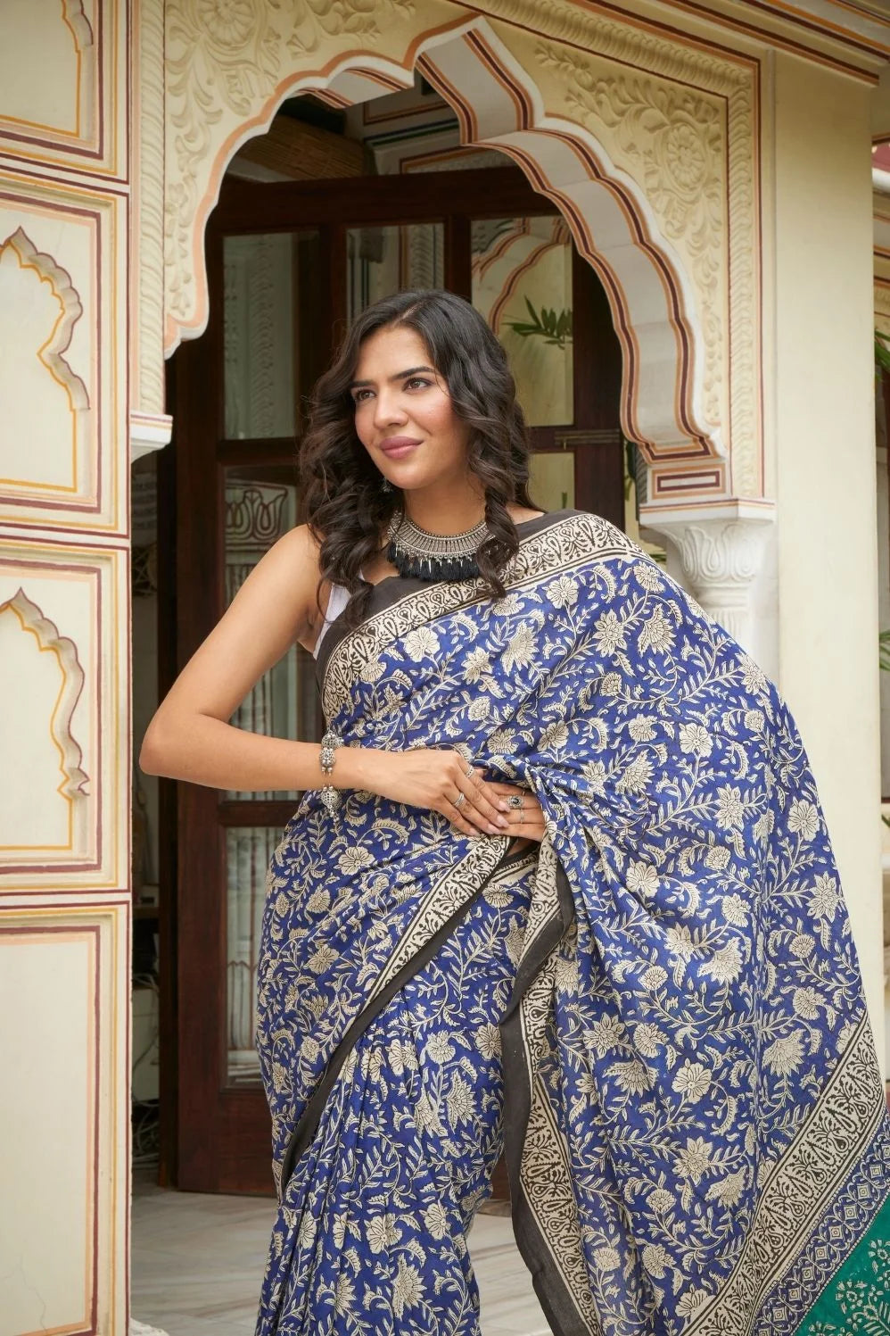 Blue and green mulmul cotton saree with detailed hand block print.