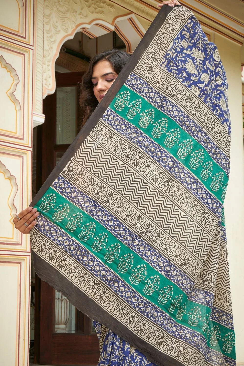 Blue and green mulmul cotton saree with detailed hand block print.