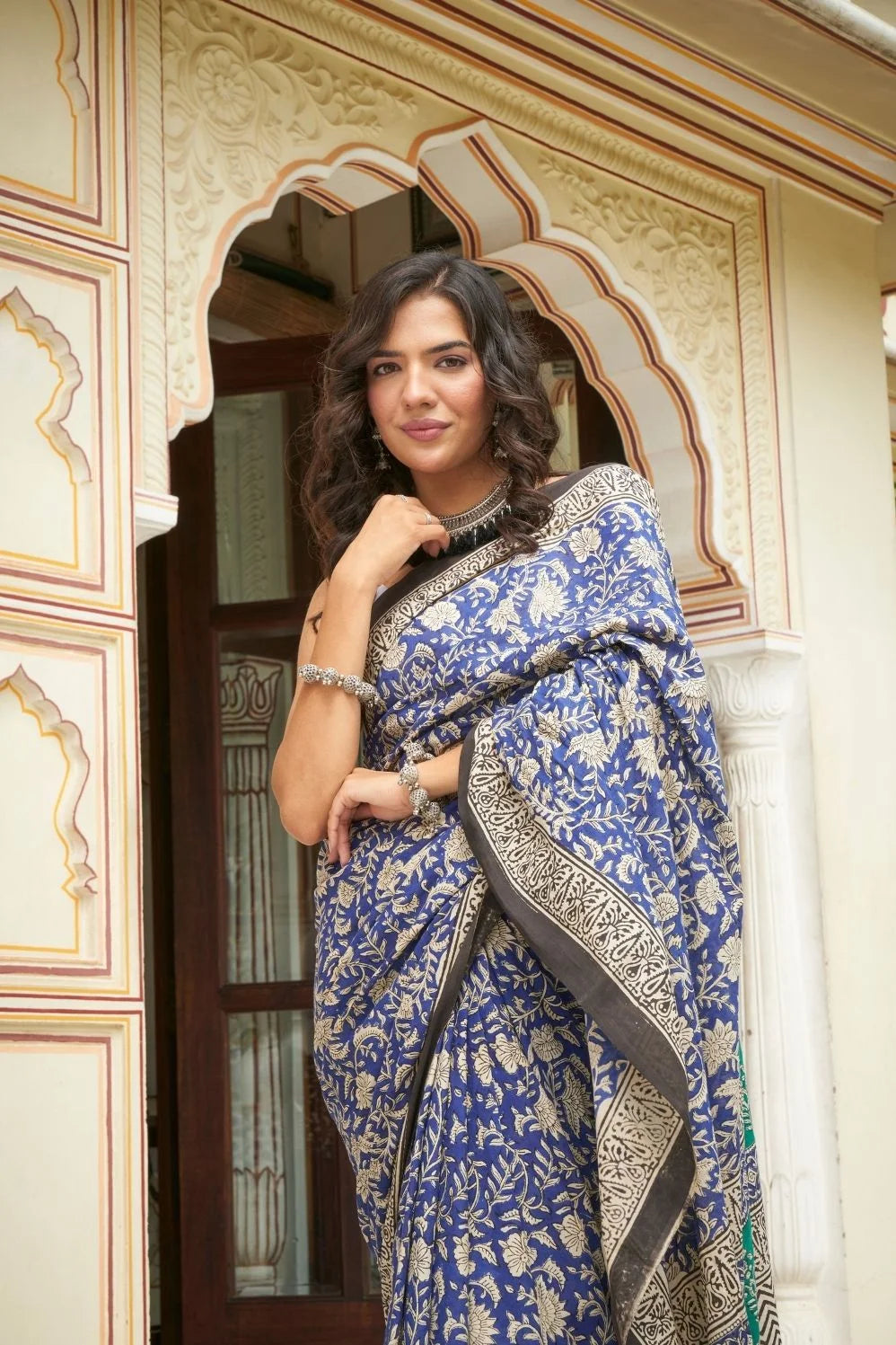 Blue and green mulmul cotton saree with detailed hand block print.