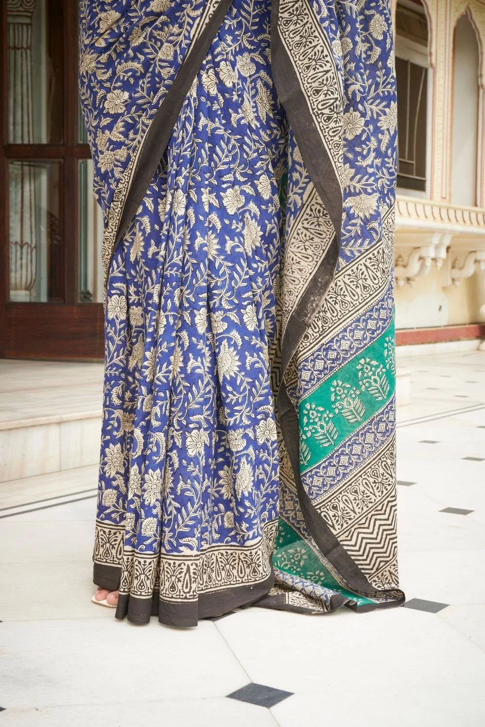 Blue and green mulmul cotton saree with detailed hand block print.