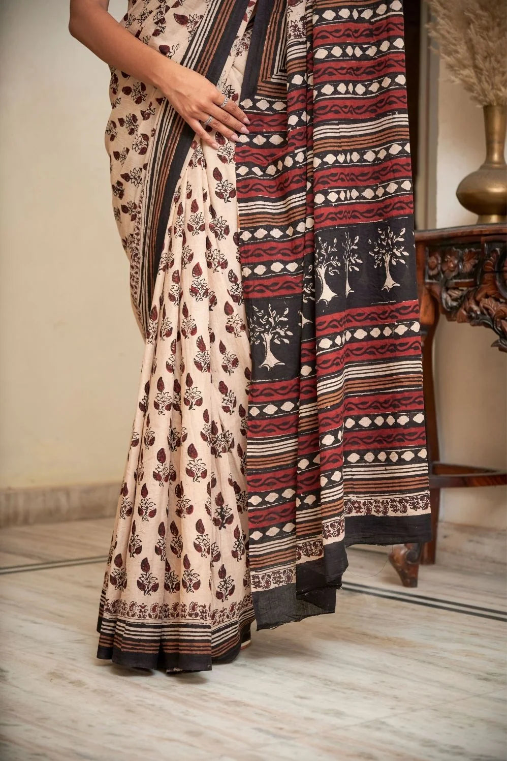 Cream mulmul cotton saree with artistic block printing.