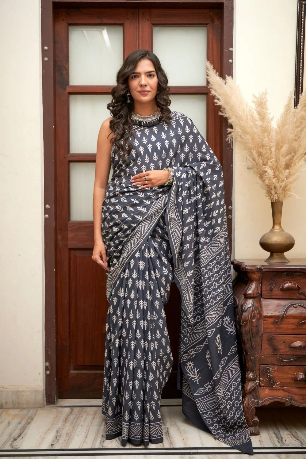 Deep blue mulmul cotton saree with elegant block print.