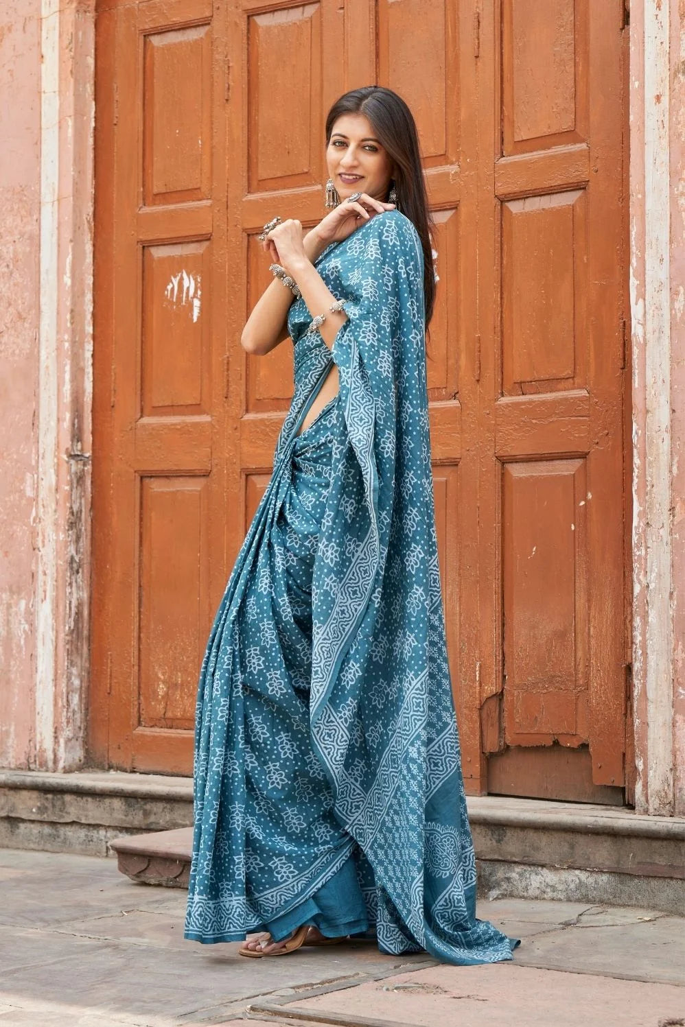 Green mulmul cotton saree with stunning hand block designs.