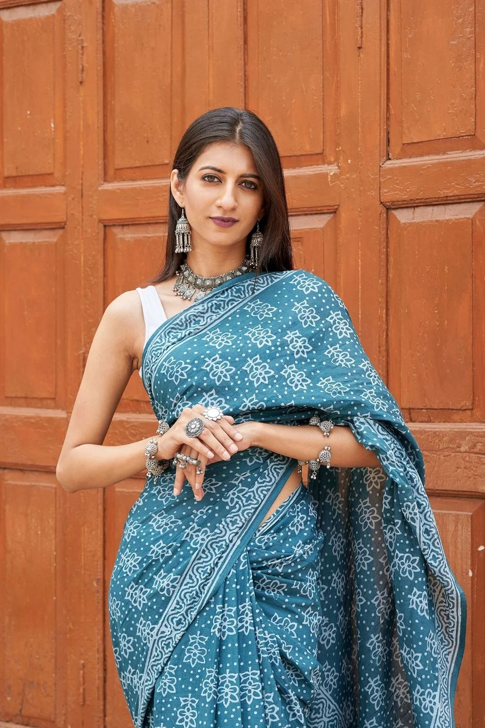 Green mulmul cotton saree with stunning hand block designs.