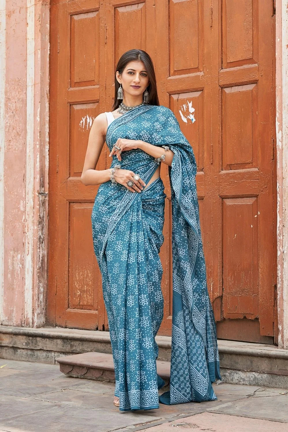 Green mulmul cotton saree with stunning hand block designs.