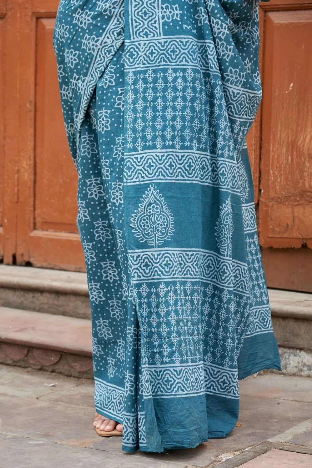Green mulmul cotton saree with stunning hand block designs.