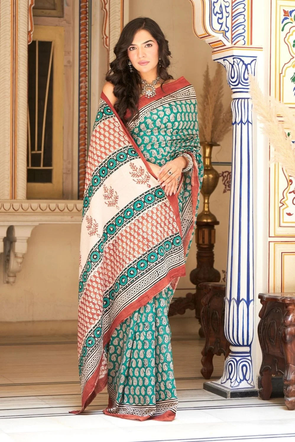 Green mulmul cotton saree with stunning hand block designs.