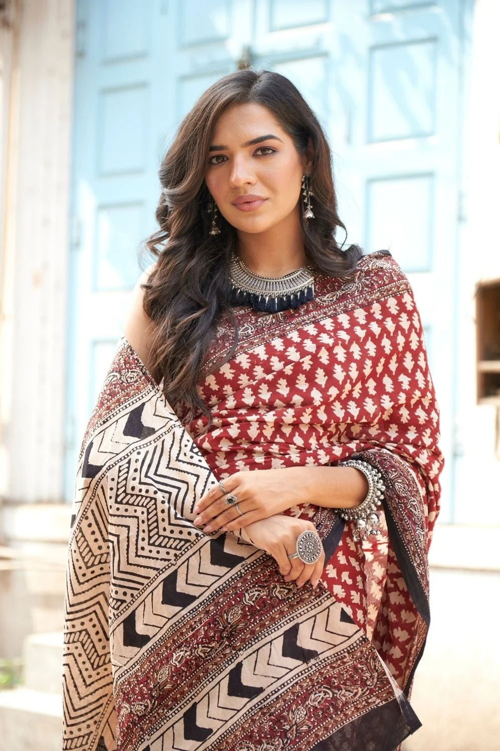 Hot red mulmul cotton saree with artistic block prints.