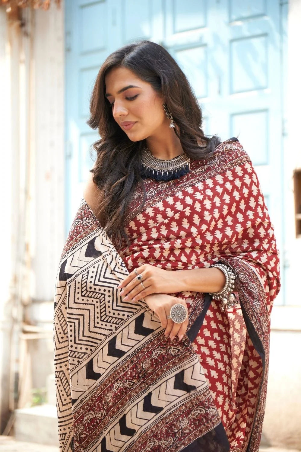 Hot red mulmul cotton saree with artistic block prints.