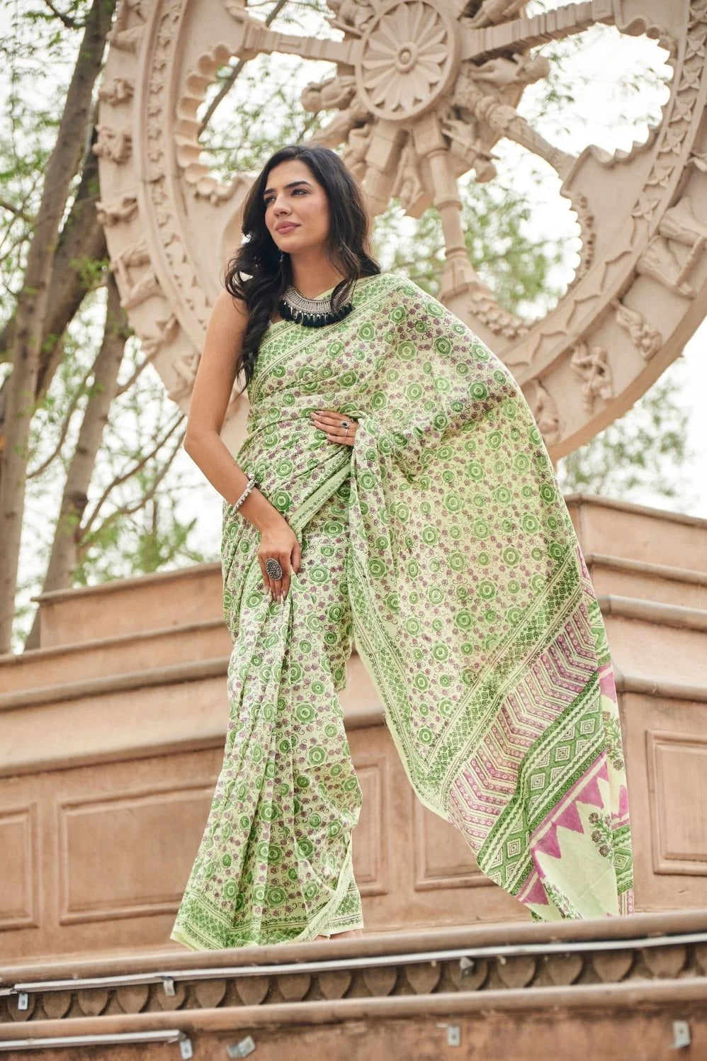 Light green mulmul cotton saree with detailed hand block motifs.