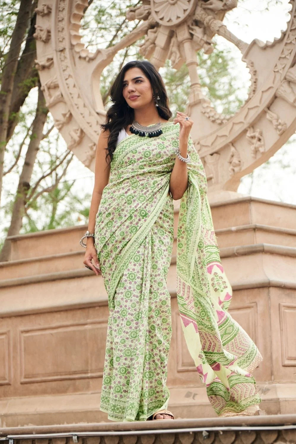 Light green mulmul cotton saree with detailed hand block motifs.