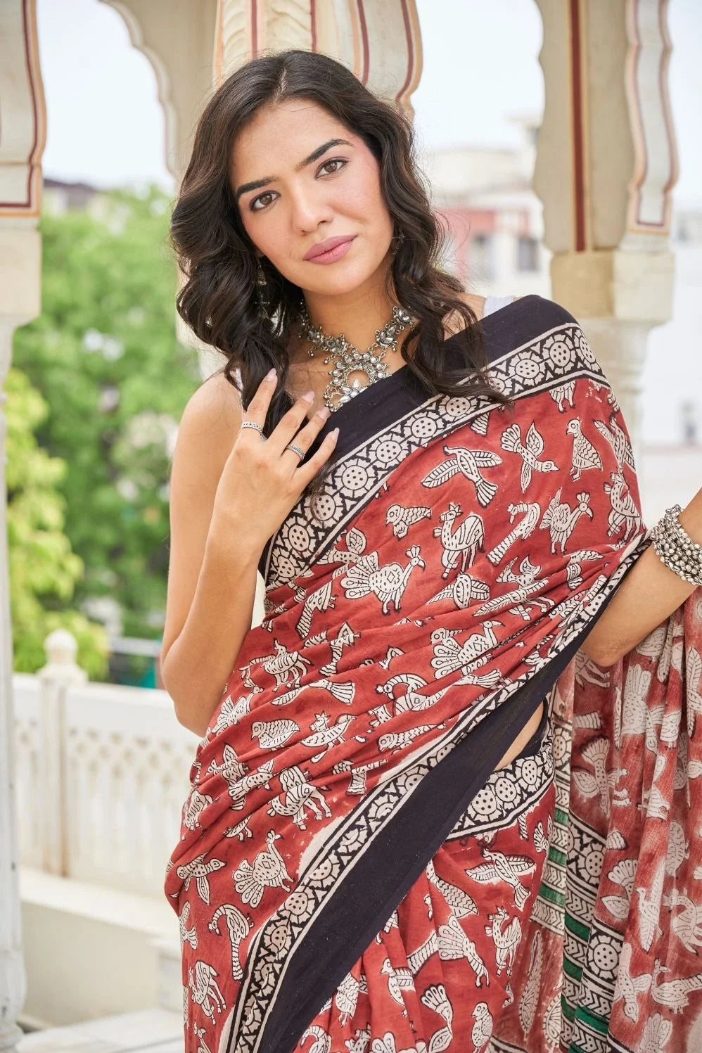 Elegance red mulmul cotton saree in animal motifs