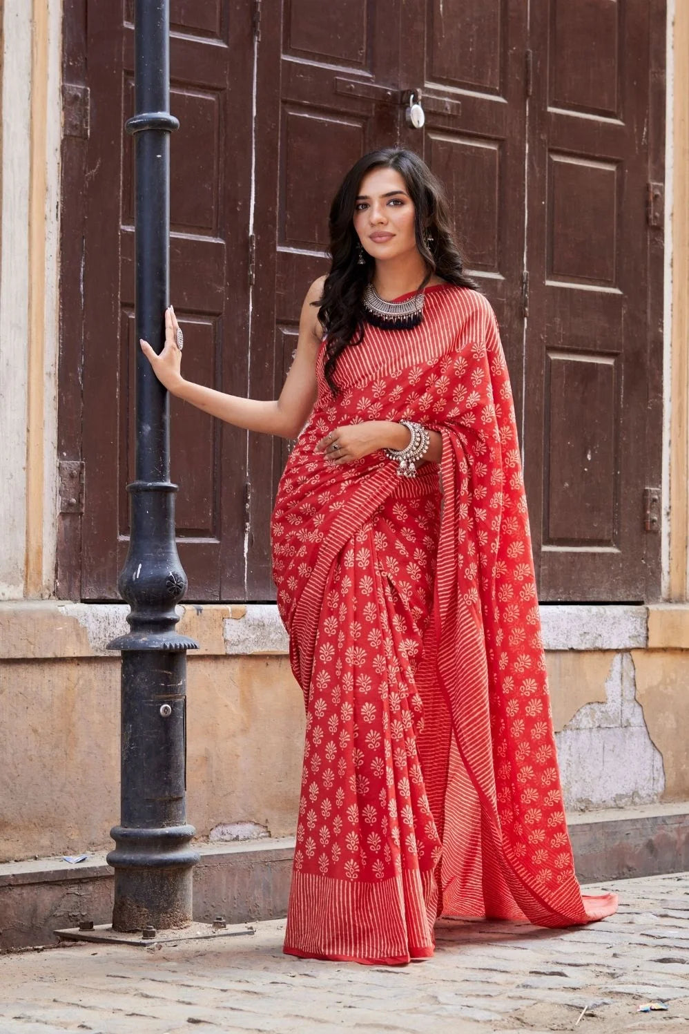 Red mulmul cotton saree with hand block design.