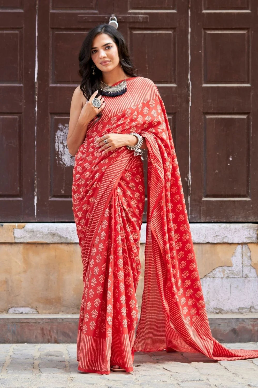 Red mulmul cotton saree with hand block design.