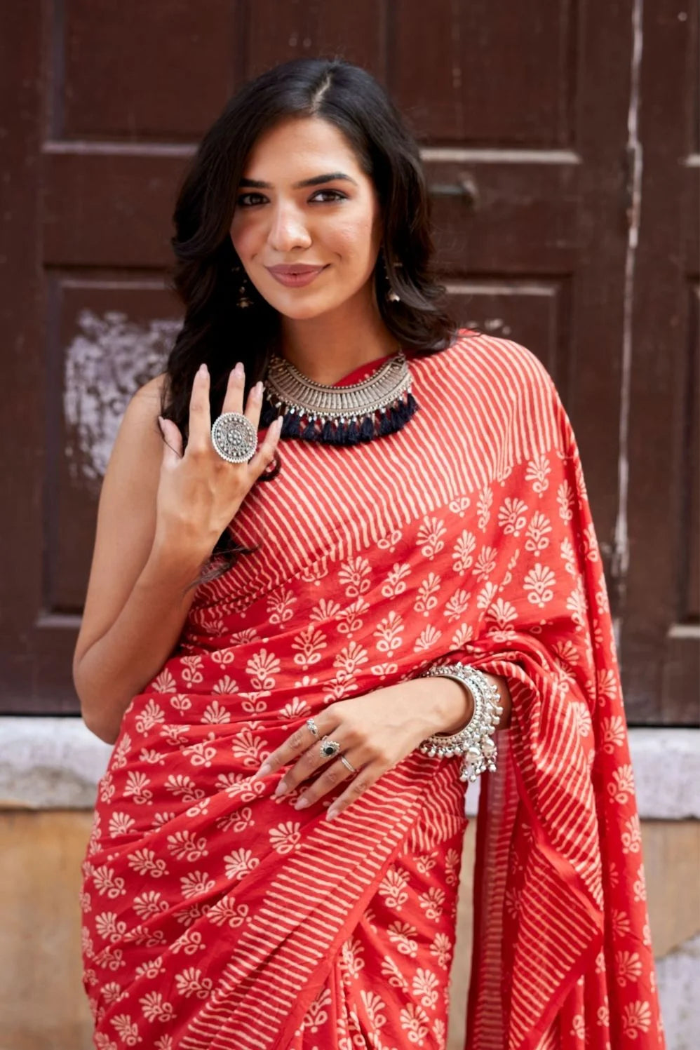 Red mulmul cotton saree with hand block design.