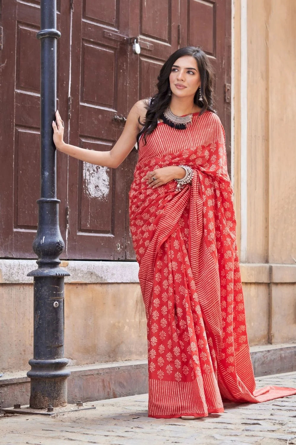 Red mulmul cotton saree with hand block design.