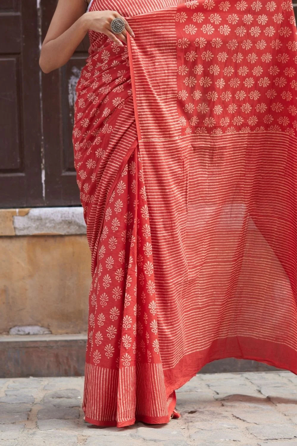 Red mulmul cotton saree with hand block design.