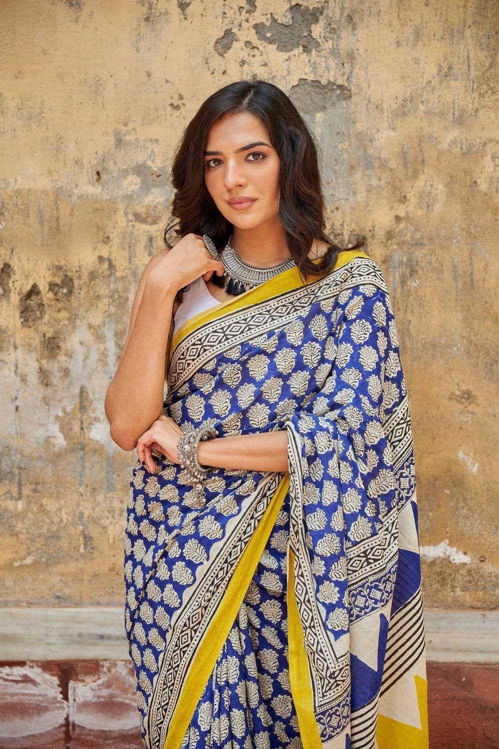 Royal blue and yellow mulmul cotton saree with artistic prints.