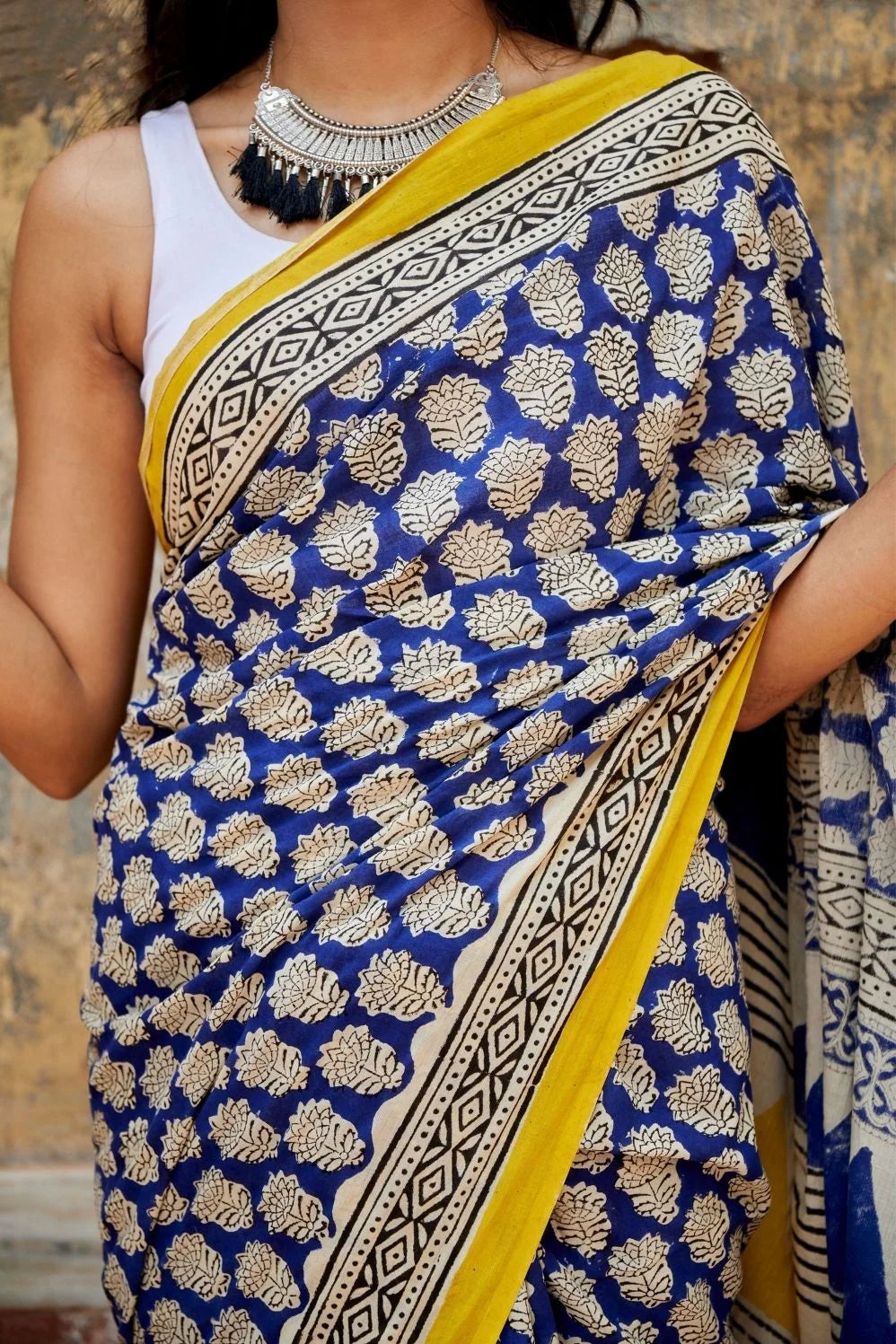 Royal blue and yellow mulmul cotton saree with artistic prints.