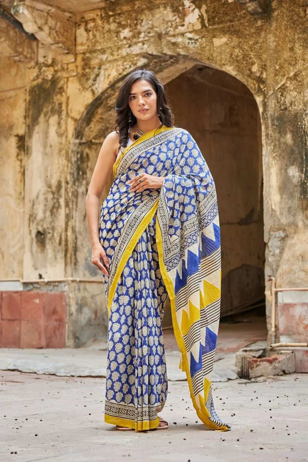 Royal blue and yellow mulmul cotton saree with artistic prints.