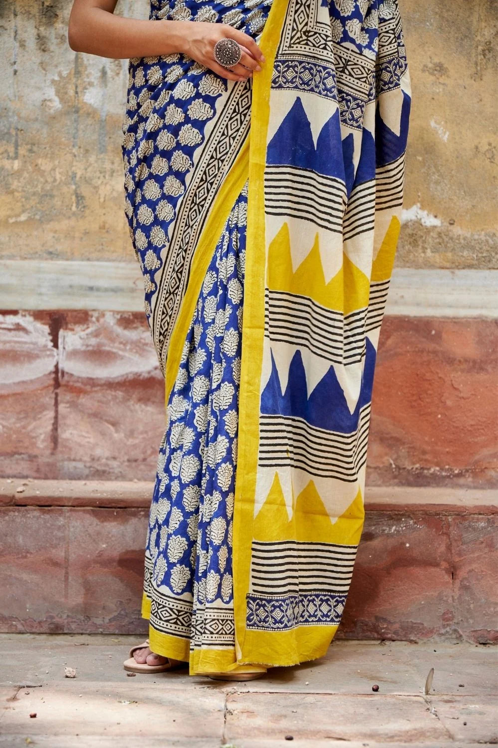 Royal blue and yellow mulmul cotton saree with artistic prints.