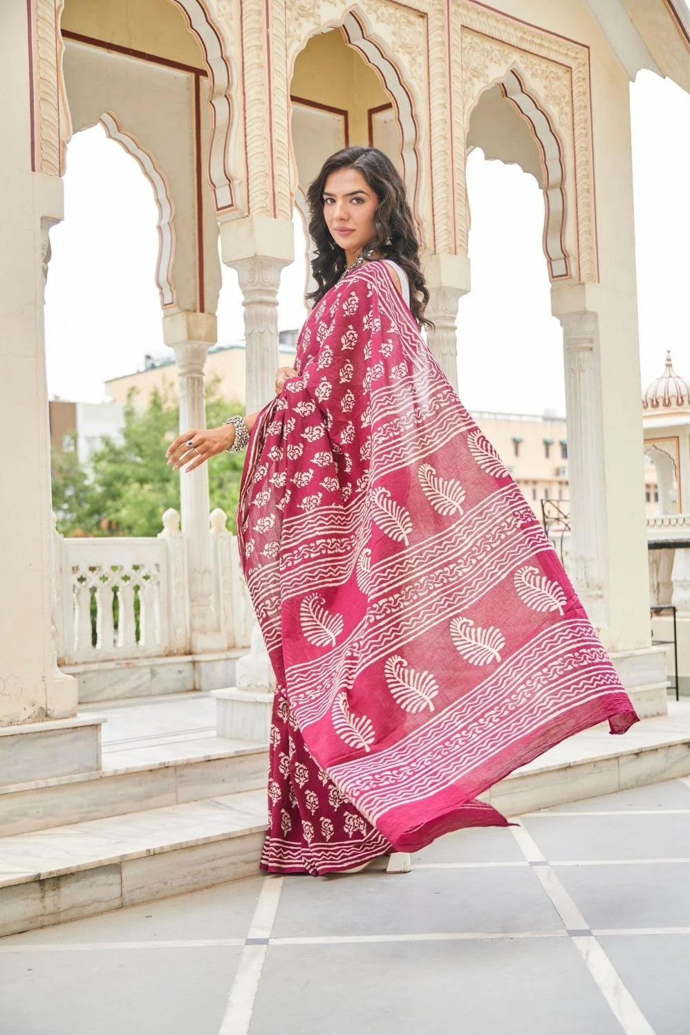 Wine red mulmul cotton saree with delicate hand block work.