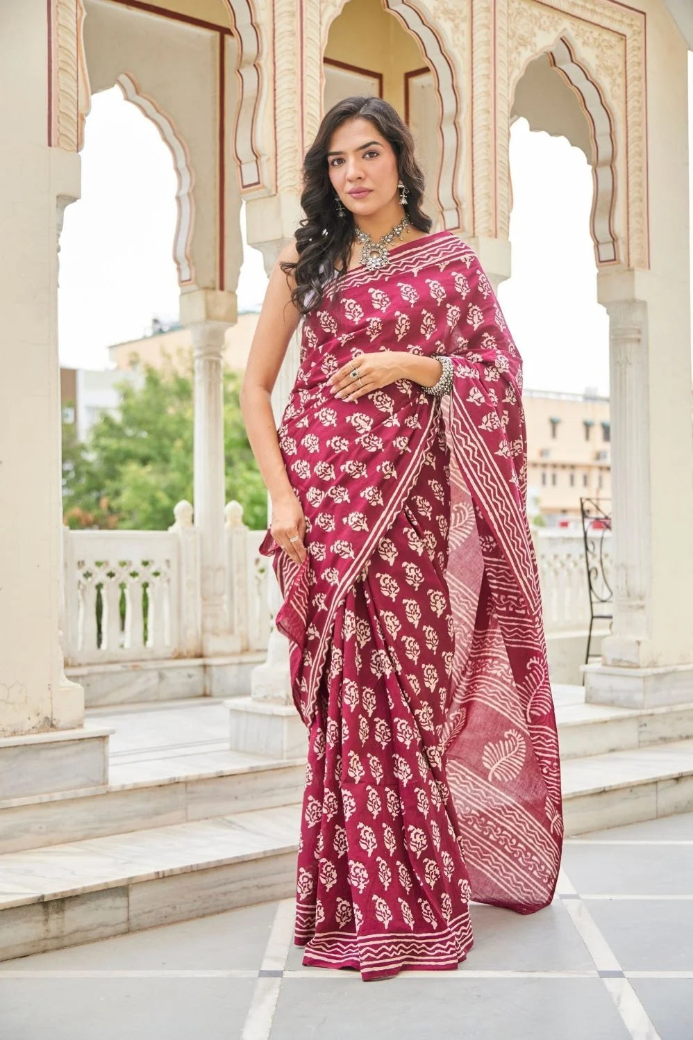Wine red mulmul cotton saree with delicate hand block work.