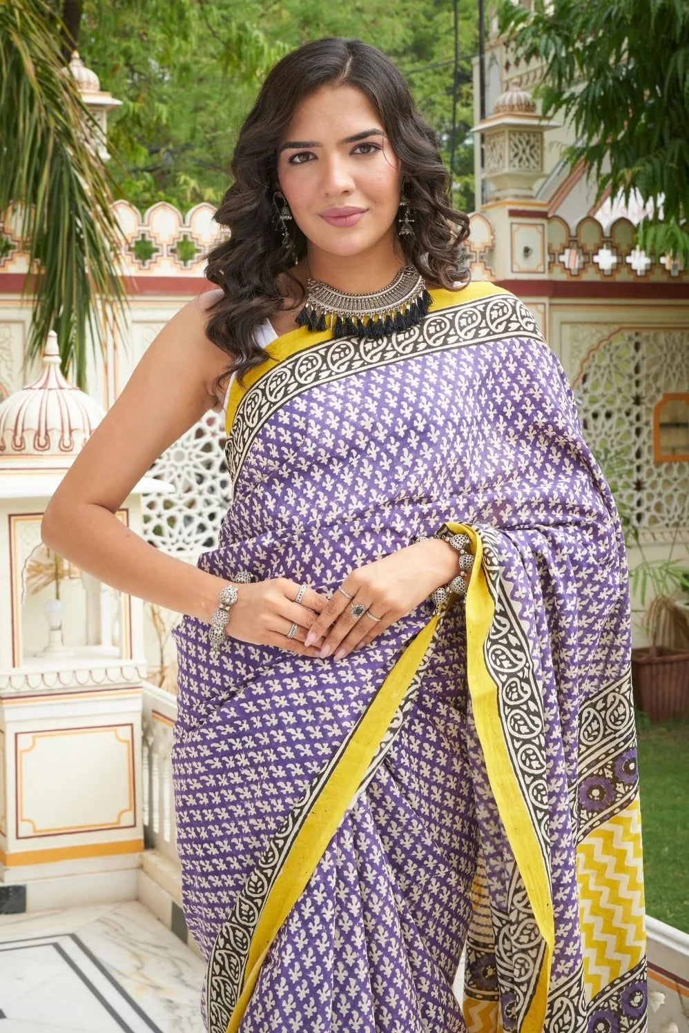Yellow and blue mulmul cotton saree with handcrafted block prints.