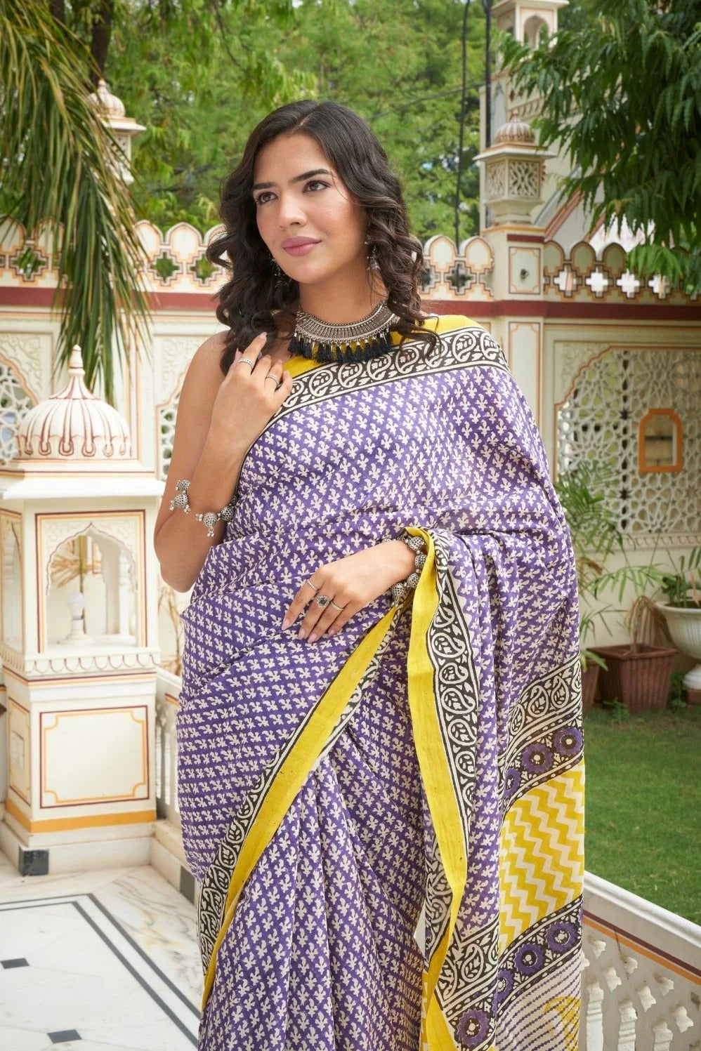 Yellow and blue mulmul cotton saree with handcrafted block prints.