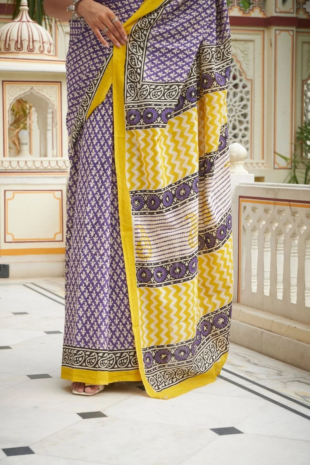Yellow and blue mulmul cotton saree with handcrafted block prints.