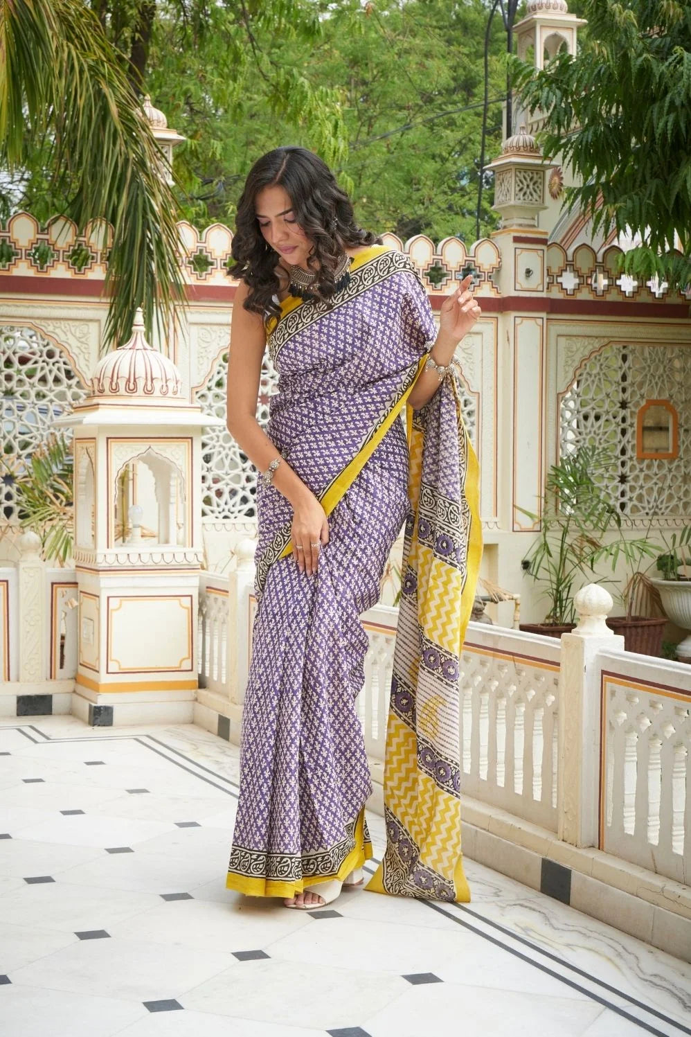 Yellow and blue mulmul cotton saree with handcrafted block prints.