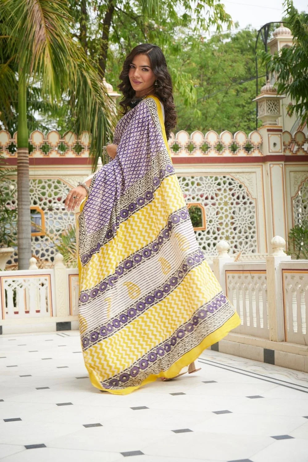 Yellow and blue mulmul cotton saree with handcrafted block prints.
