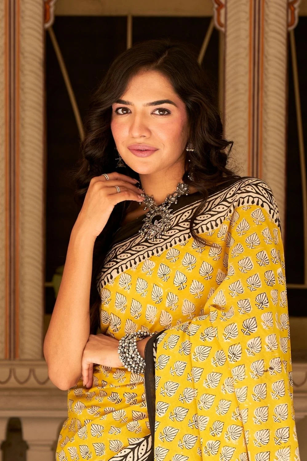 Yellow mulmul cotton saree with traditional hand block prints.