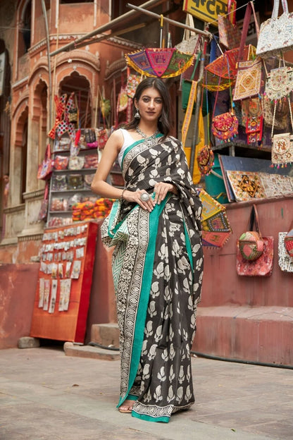Black mulmul cotton saree with elegant handcrafted motifs.