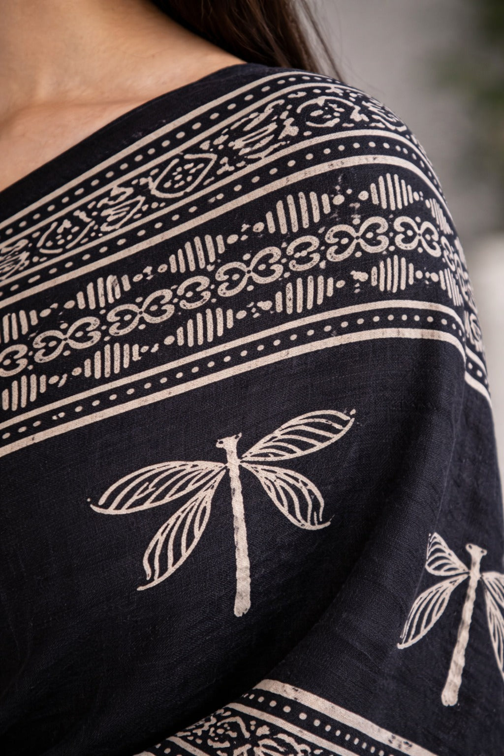 Black cotton saree with white dragonfly and geometric patterns