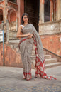 Black mulmul cotton saree with lined block print design.