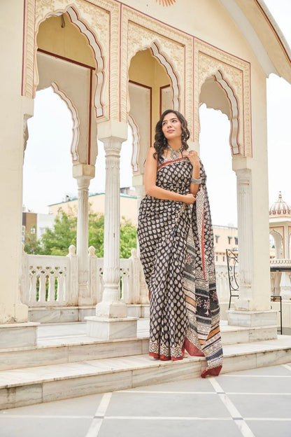 Black mulmul cotton saree with elegant handcrafted motifs.