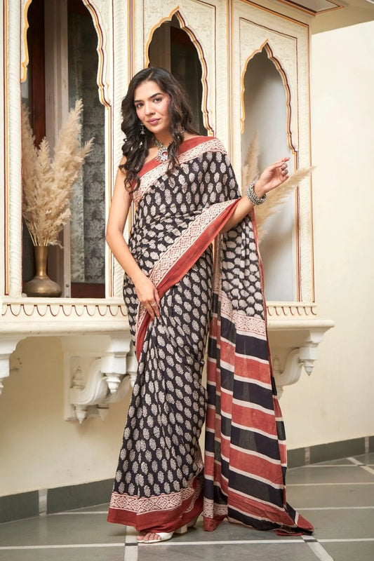 Black mulmul cotton saree with elegant handcrafted motifs.