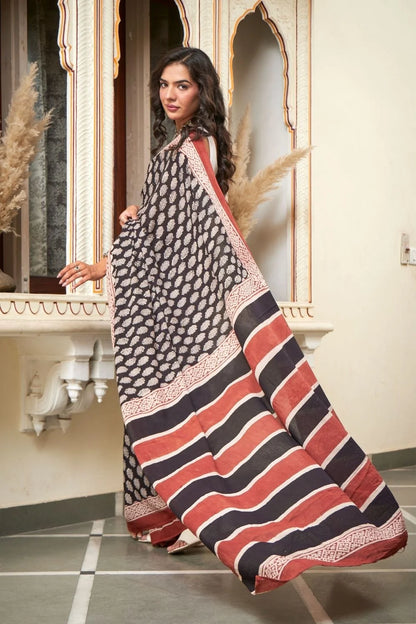 Black mulmul cotton saree with elegant handcrafted motifs.