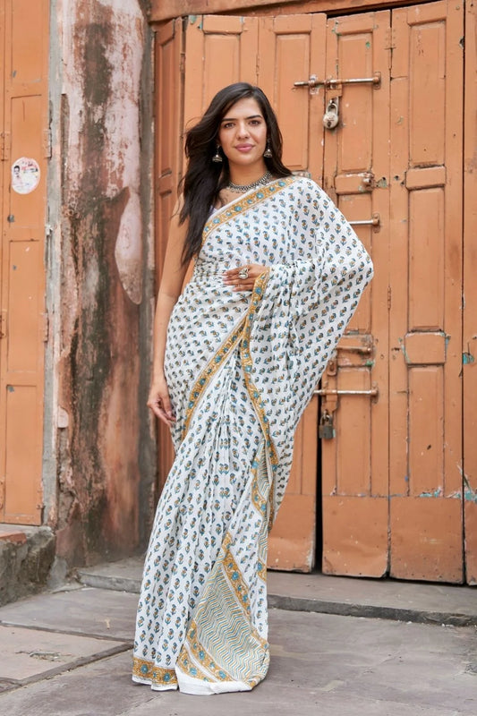 White mulmul cotton saree with intricate block printing.