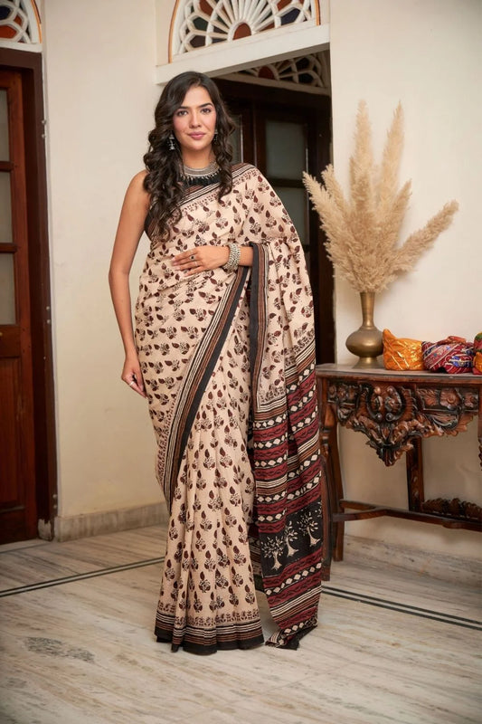 Cream mulmul cotton saree with artistic block printing.