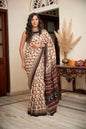 Cream mulmul cotton saree with artistic block printing.