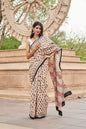 Cream Red mulmul cotton saree with artistic block printing.