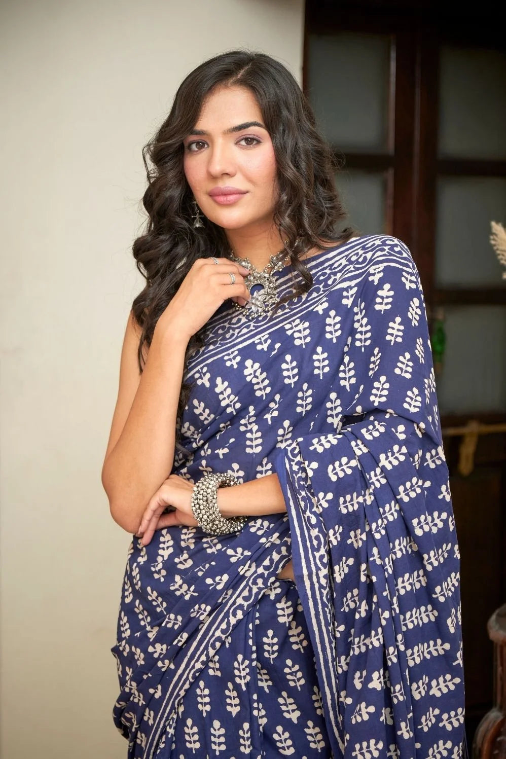 Dark blue mulmul cotton saree with intricate block prints.