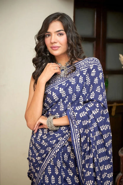Dark blue mulmul cotton saree with intricate block prints.