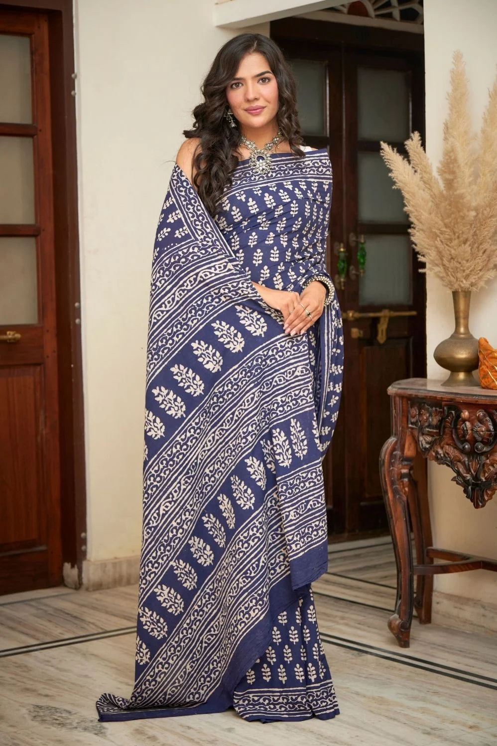 Dark blue mulmul cotton saree with intricate block prints.
