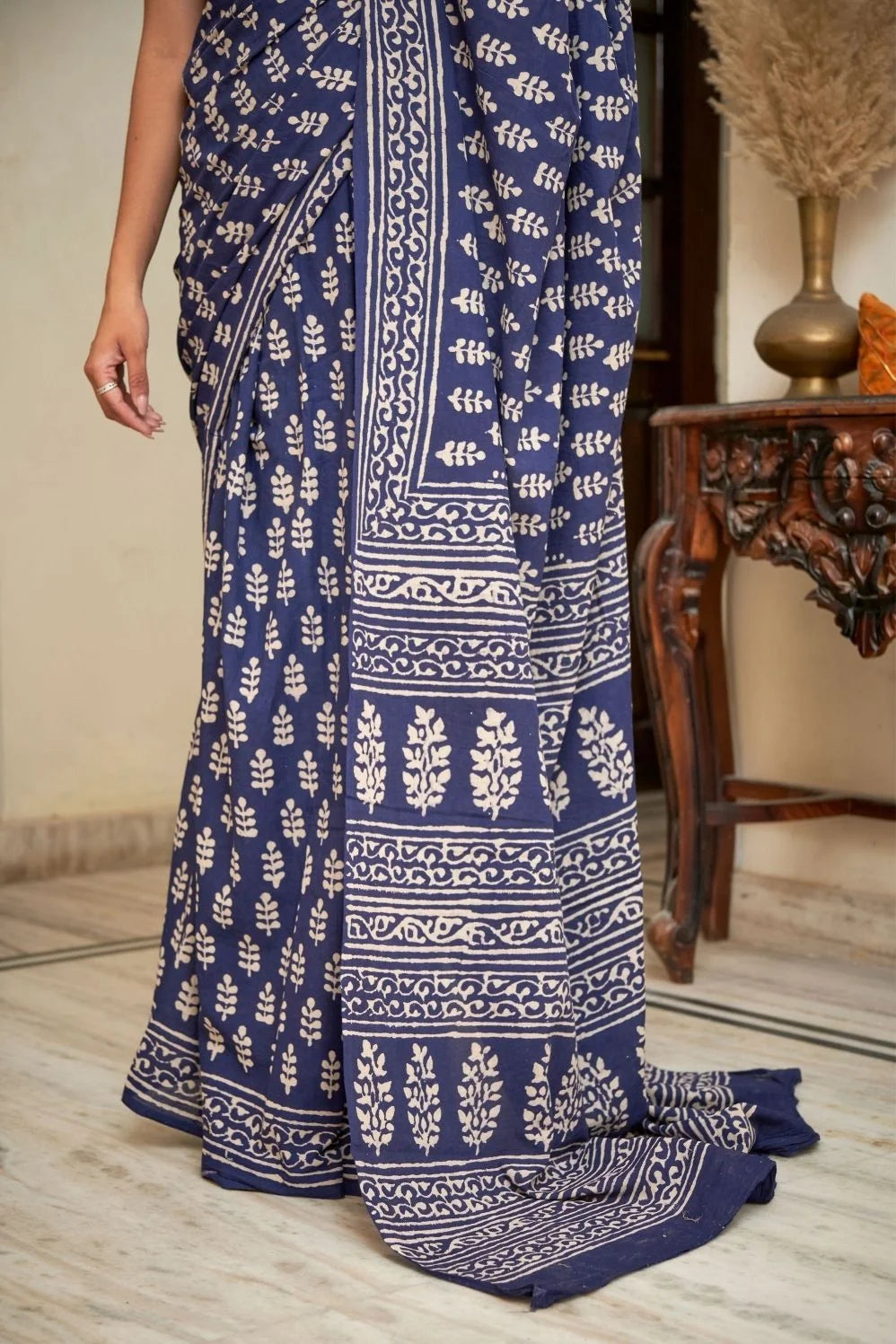 Dark blue mulmul cotton saree with intricate block prints.