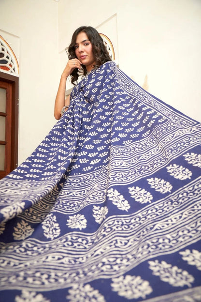 Dark blue mulmul cotton saree with intricate block prints.