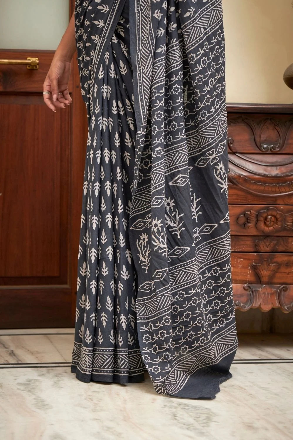 Deep blue mulmul cotton saree with elegant block print.
